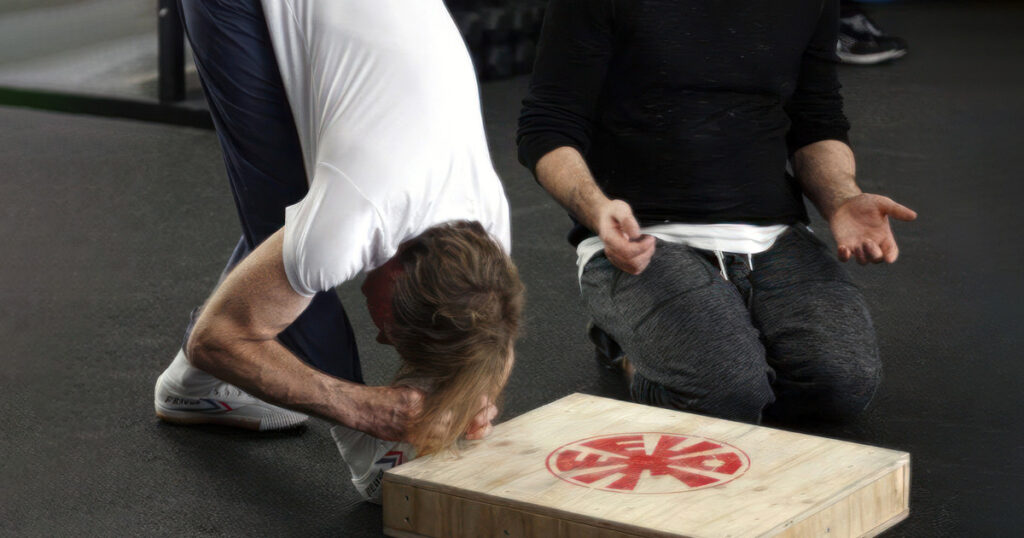 Man demonstrating an dynamic active flexibility exercise